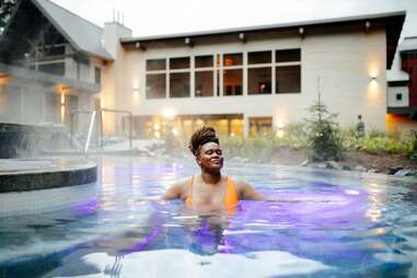 woman enjoying hot springs at alyeska nordic spa