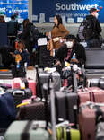 Southwest Airlines passengers wait in line at the Southwest Baggage Services office to locate their bags at BWI Thurgood Marshall Airport in Glen Burnie, Md., on Wednesday, December 28, 2022