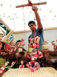 A puppeteer displays his creation for The Night of the Radishes in Oaxaca.